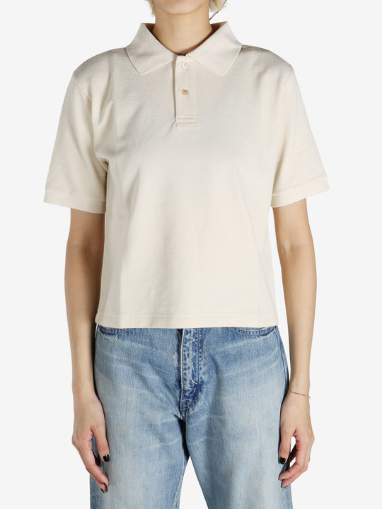 White shirt worn by a person, showing the shirt's fit