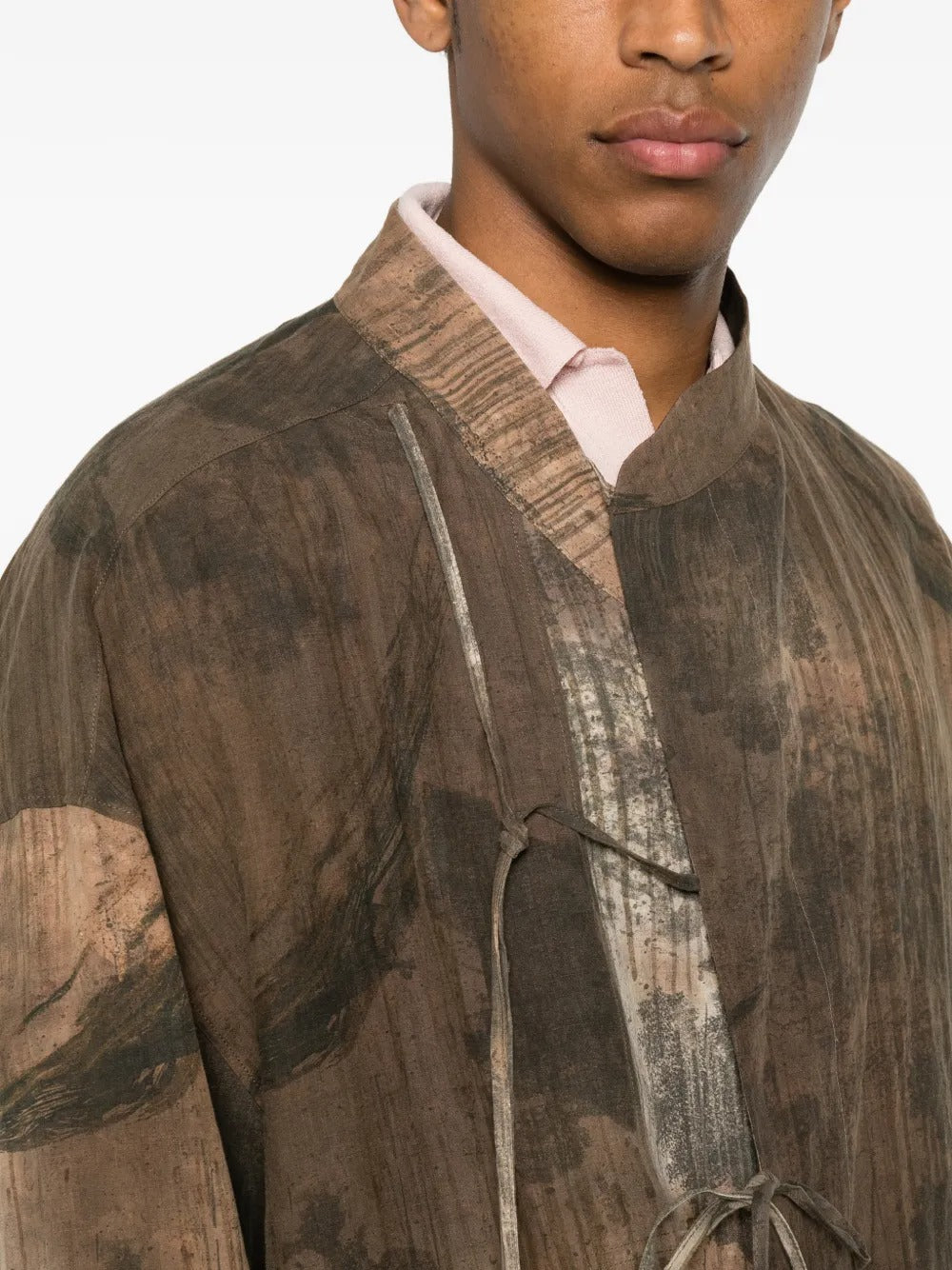 Brown shirt worn by a person, showing the shirt fit