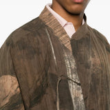 Brown shirt worn by a person, showing the shirt fit