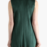 Green dress worn by a person, showing the dress's fit