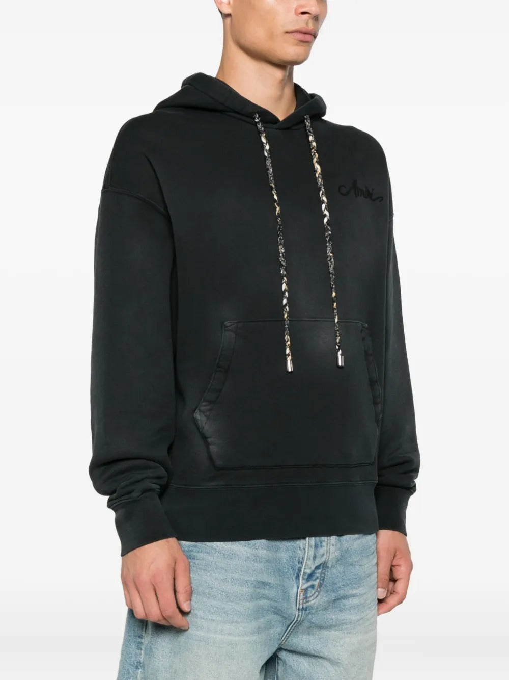 Black hoodie worn by a person, showing the hoodie's fit
