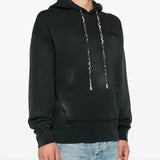 Black hoodie worn by a person, showing the hoodie's fit