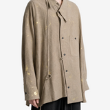 Tan shirt worn by a person, showing the shirt fit