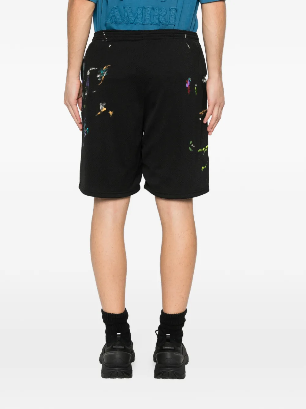 Black shorts worn by a person, showing the shorts fit