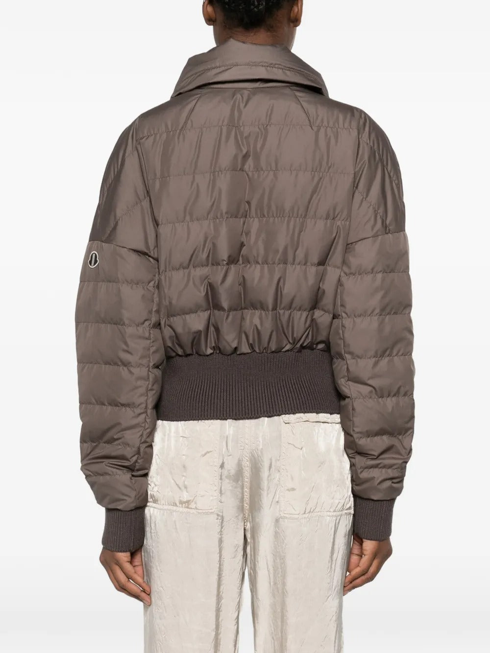 Brown jackets worn by a person, showing the jackets fit