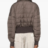 Brown jackets worn by a person, showing the jackets fit