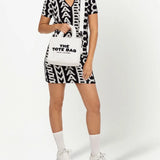 White bag carried by a person, showing the bag's fit