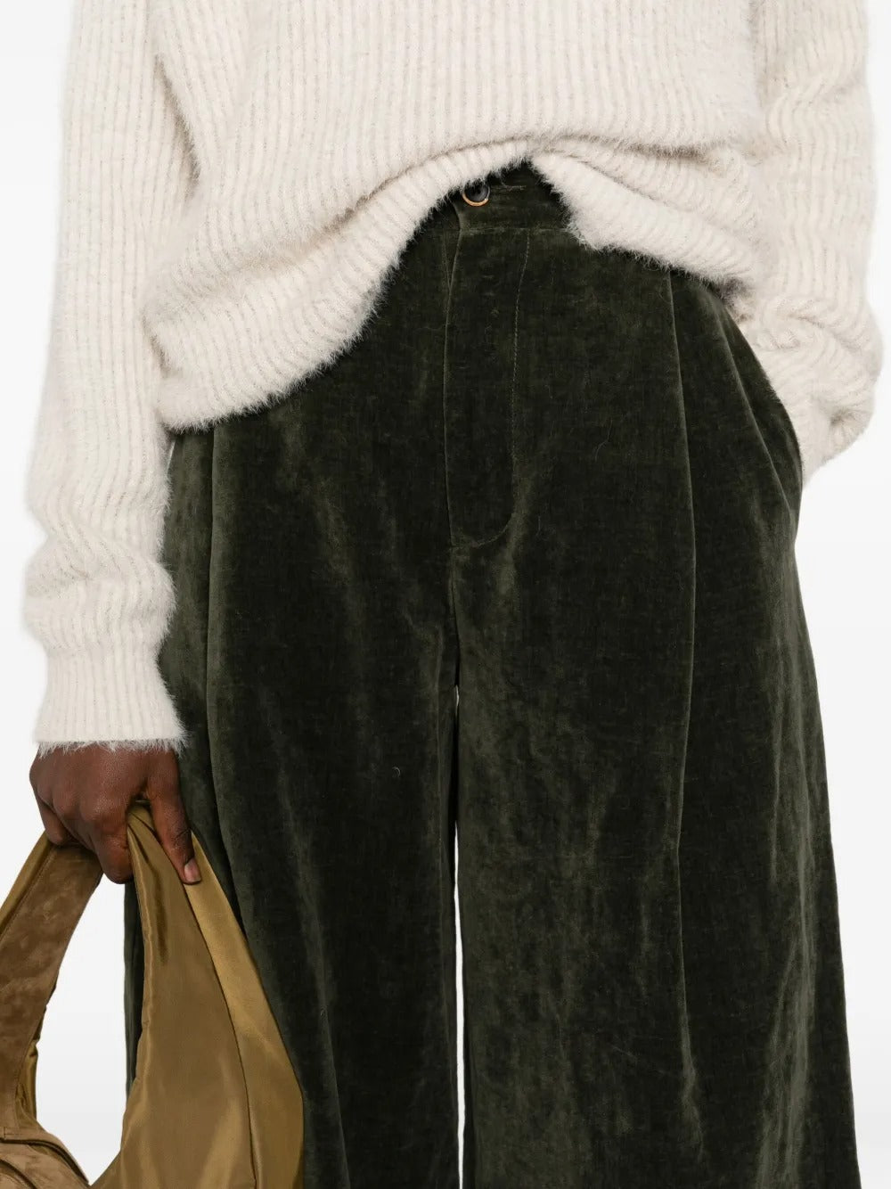 Close up of green pant, showing texture of the cotton blend fabric