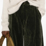 Close up of green pant, showing texture of the cotton blend fabric