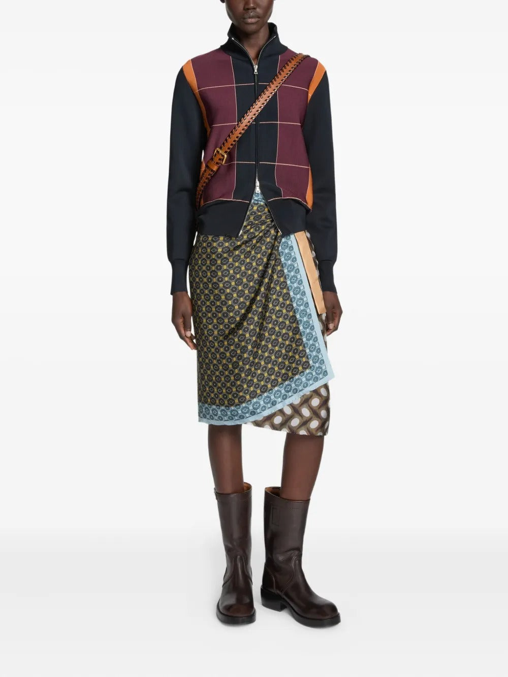 Brown boots worn by a person, showing the boots' fit