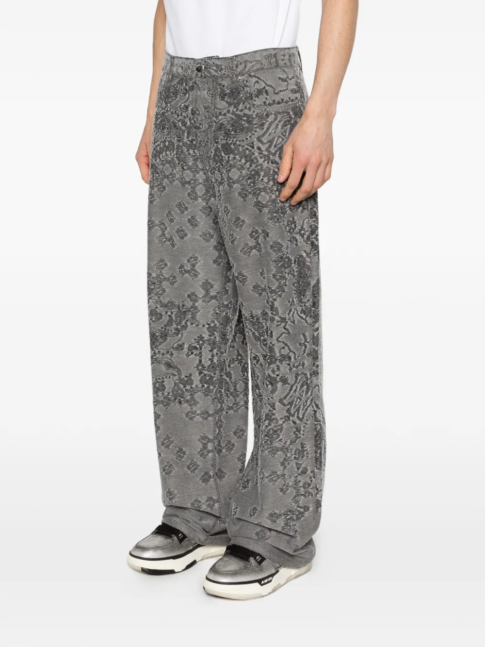 Black jeans worn by a person, showing the jeans fit