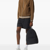 Black bag worn by a person, showing the bag's fit