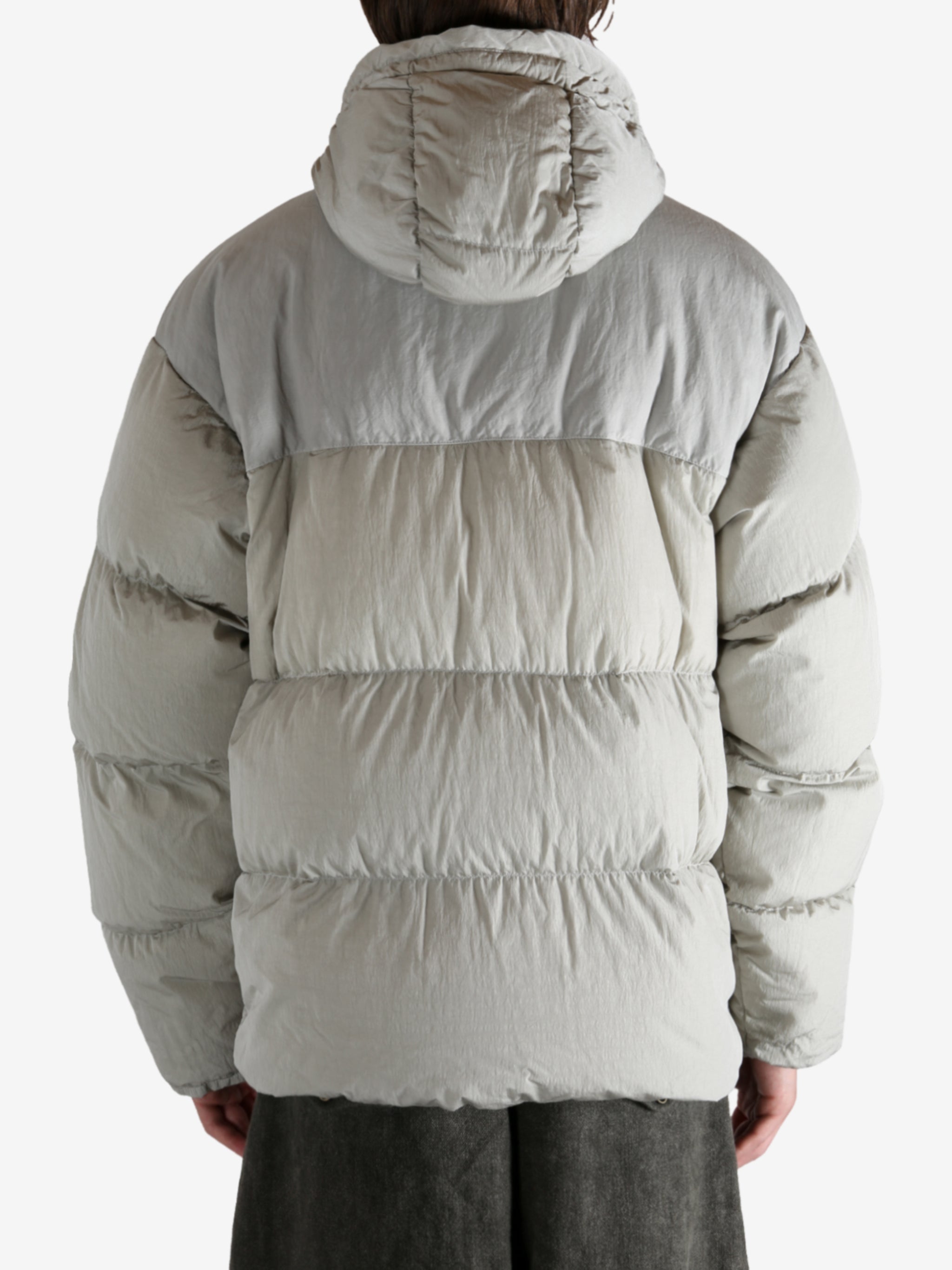 Grey jacket worn by a person, showing the jacket's fit