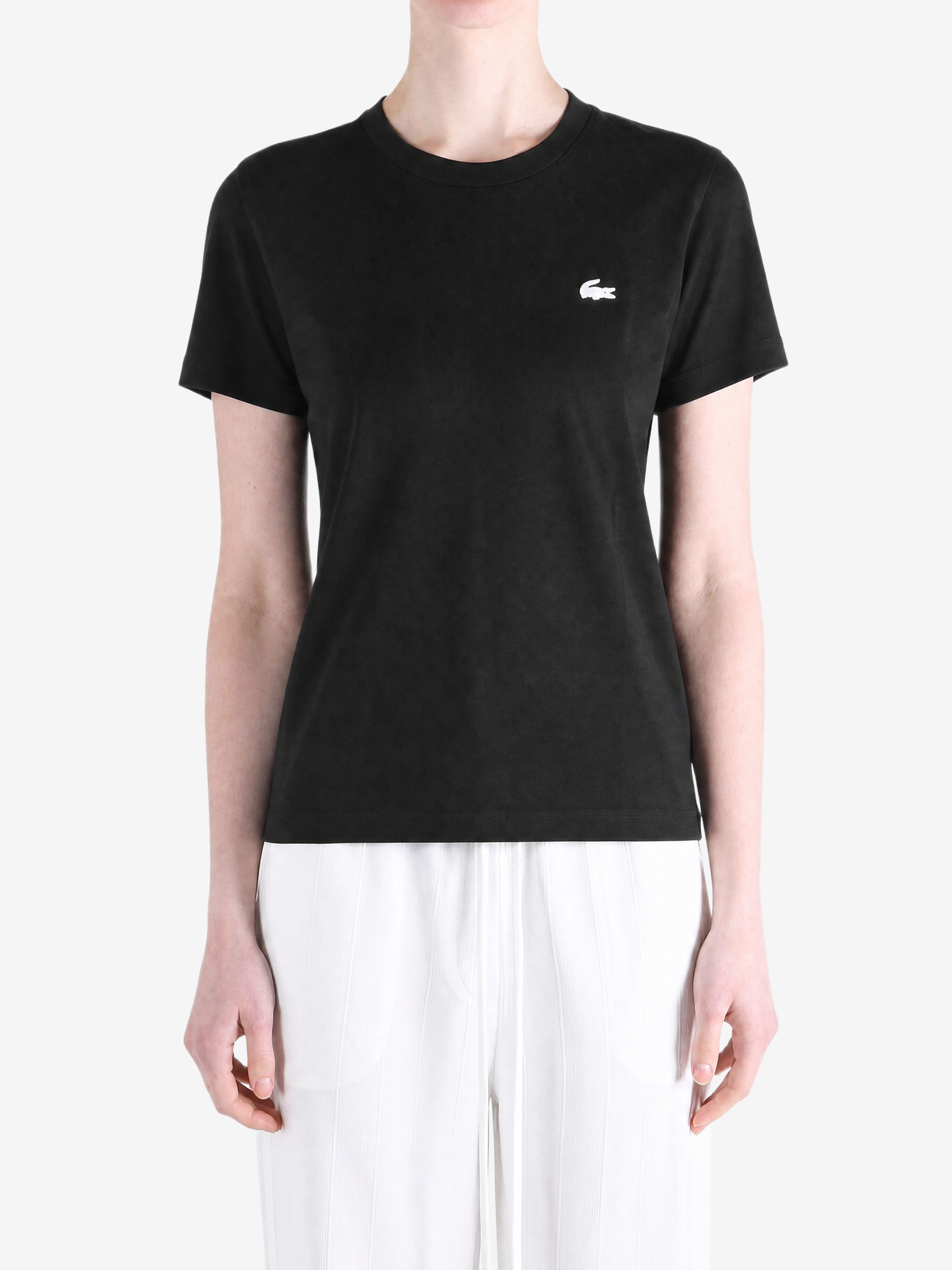 Black t-shirt worn by a person, showing the t-shirt fit