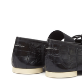 Close up of black shoes, showing texture of the leather fabric