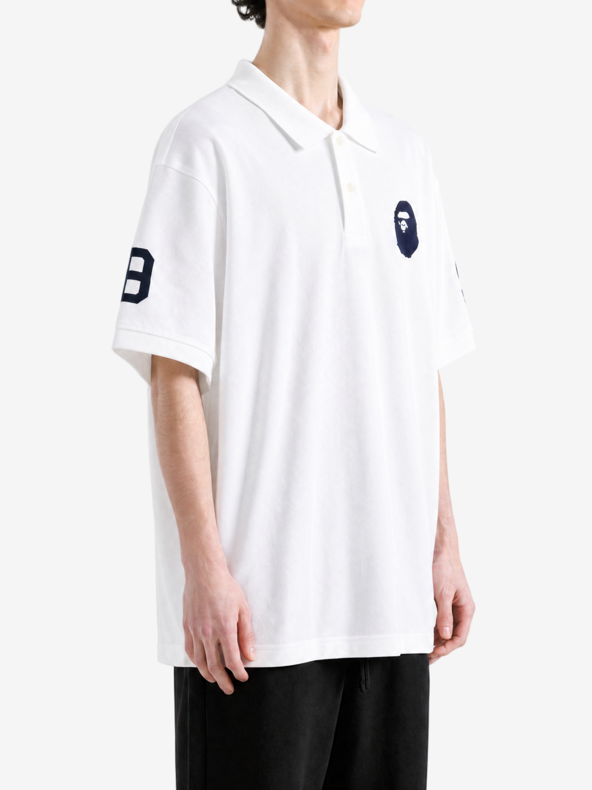 White t-shirt worn by a person, showing the t-shirt fit