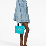 Blue bag worn by a person, showing the bag's fit