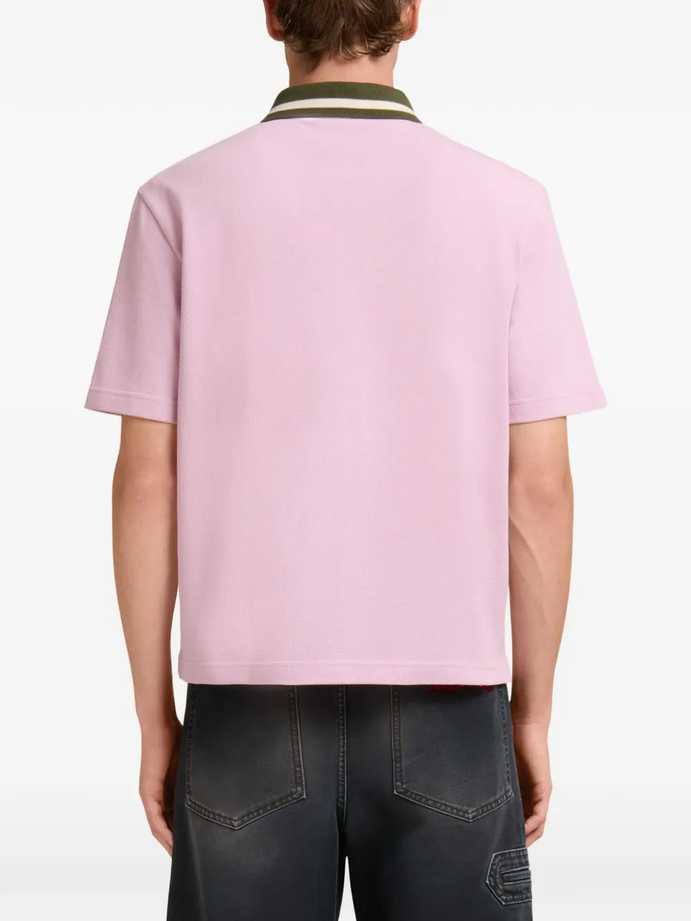 pink t-shirt worn by a person, showing the t-shirt fit