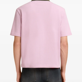 pink t-shirt worn by a person, showing the t-shirt fit