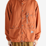 Orange jacket worn by a person, showing the jacket's fit