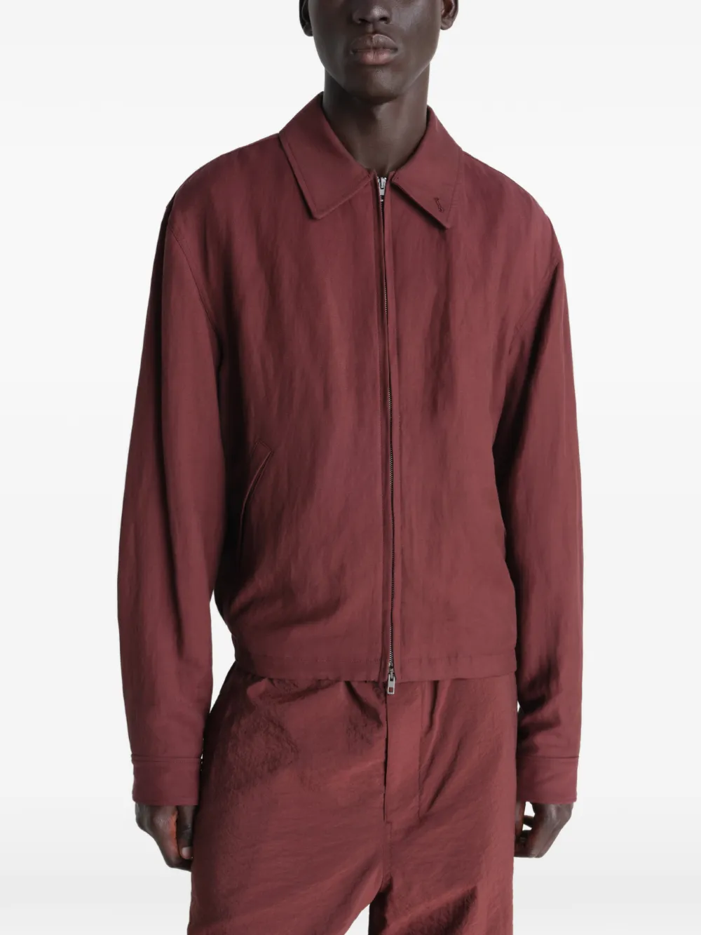 Red jacket worn by a person, showing the jacket's fit