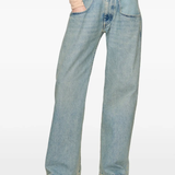Blue jeans worn by a person, showing the jeans fit