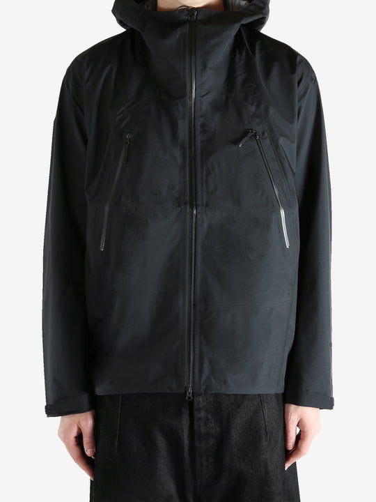 Black jacket worn by a person, showing the jacket fit