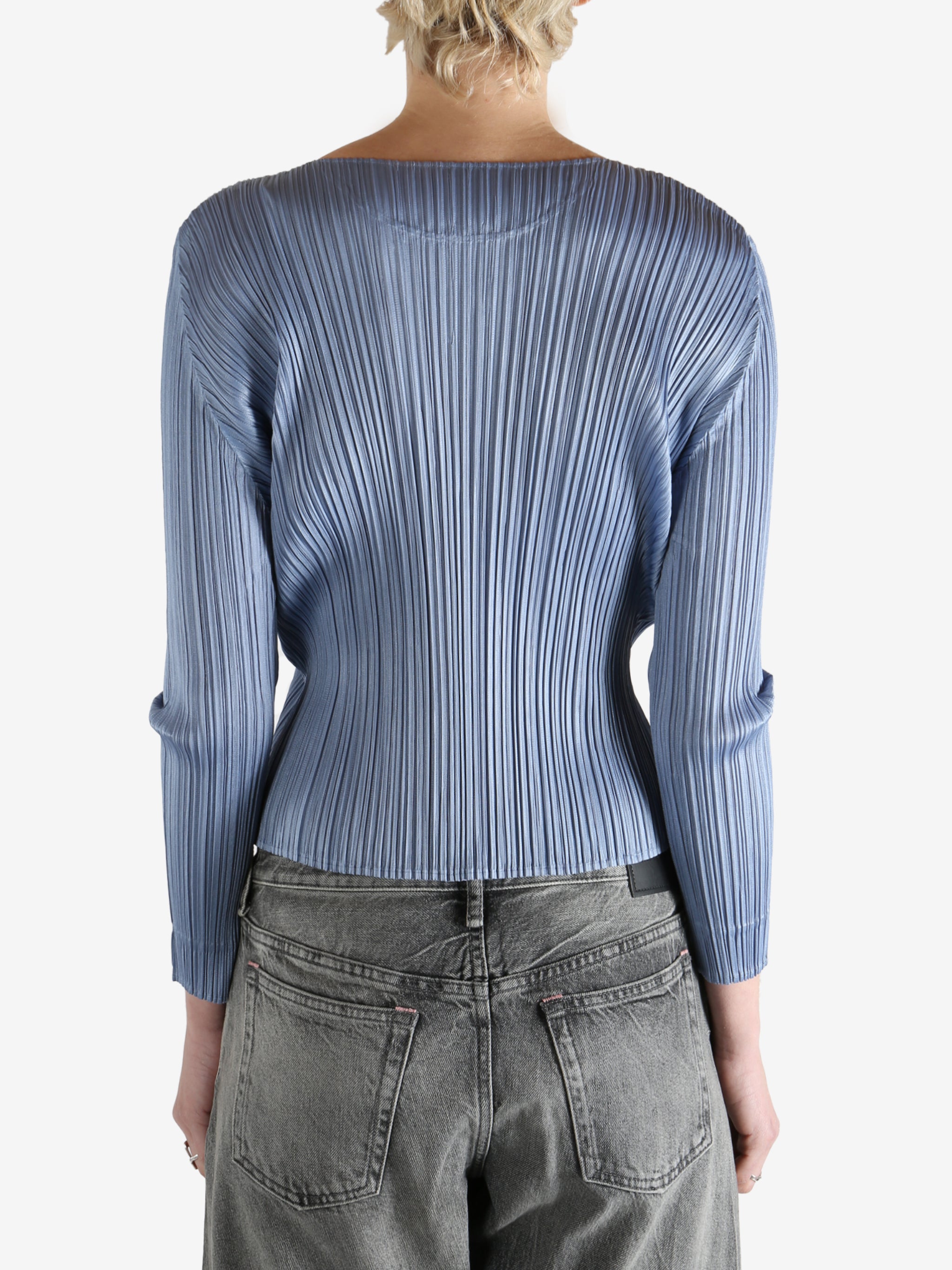 Blue top worn by a person, showing the top's fit