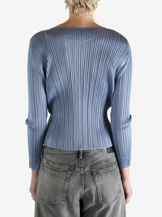 Blue top worn by a person, showing the top's fit