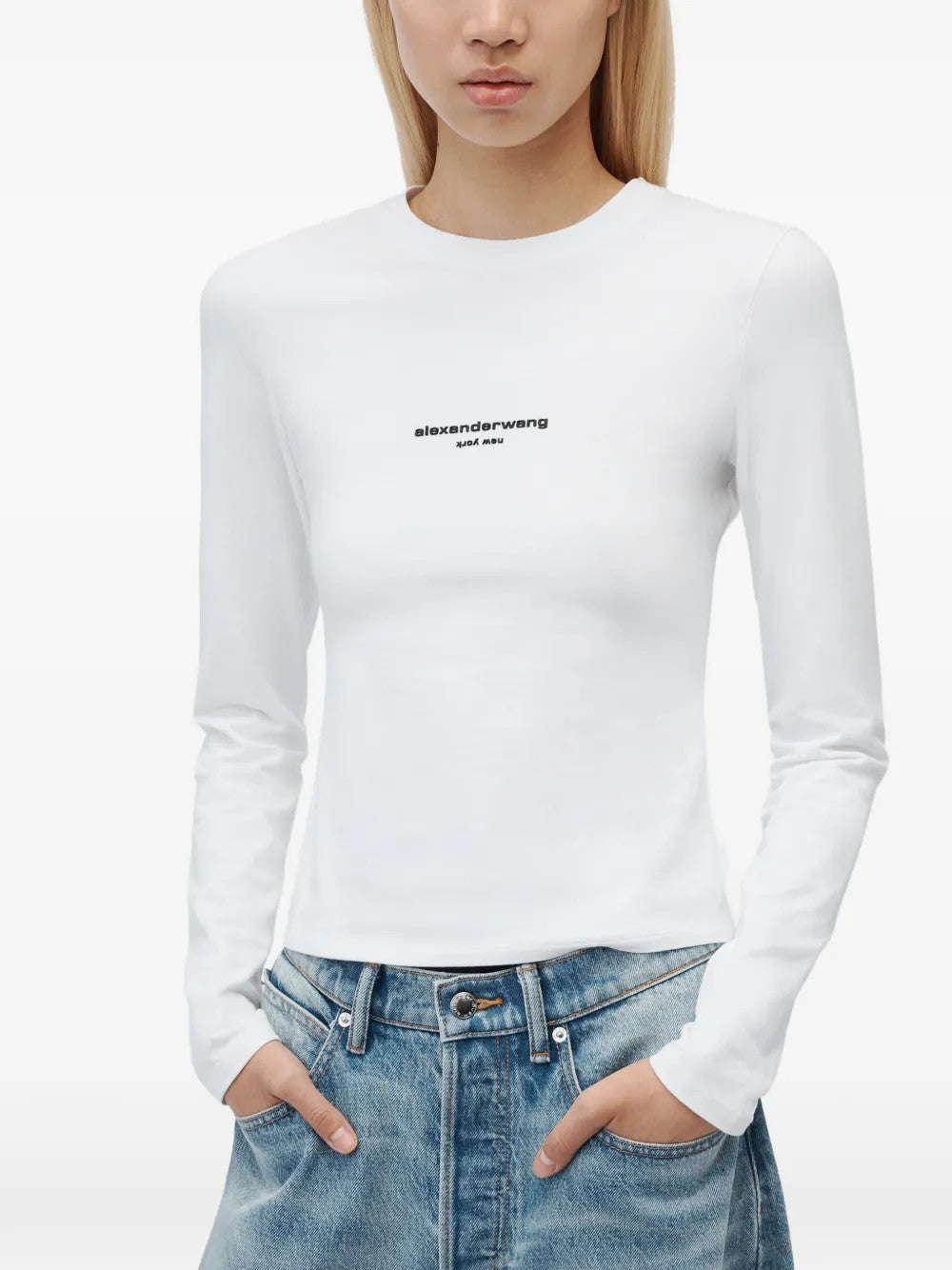 White t-shirt worn by a person, showing the t-shirt fit