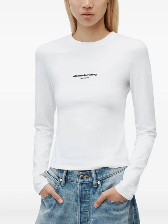 White t-shirt worn by a person, showing the t-shirt fit