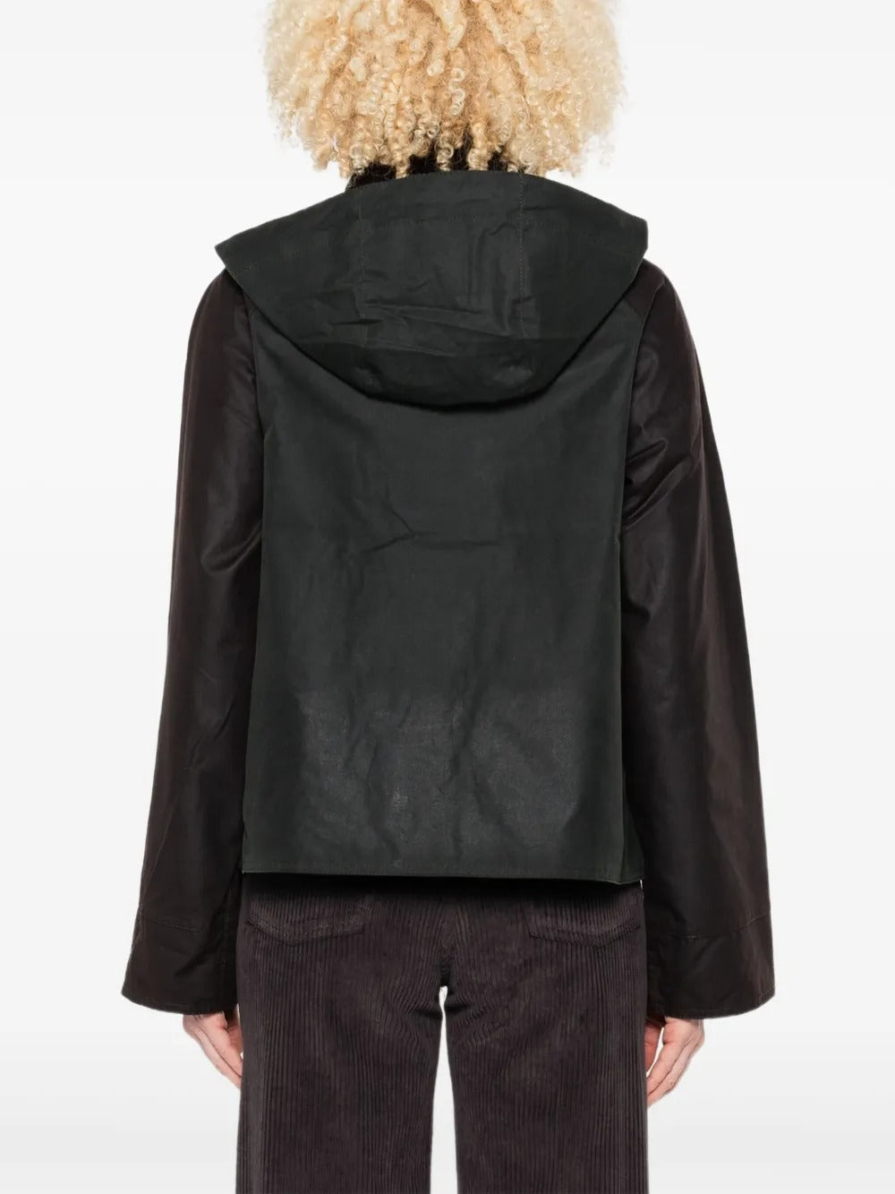 Green jacket worn by a person, showing the jacket's fit