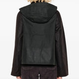 Green jacket worn by a person, showing the jacket's fit