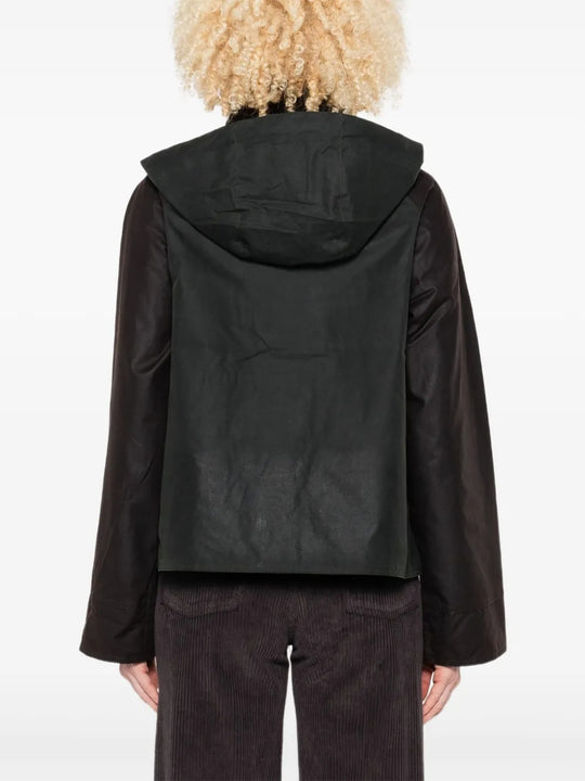 Green jacket worn by a person, showing the jacket's fit