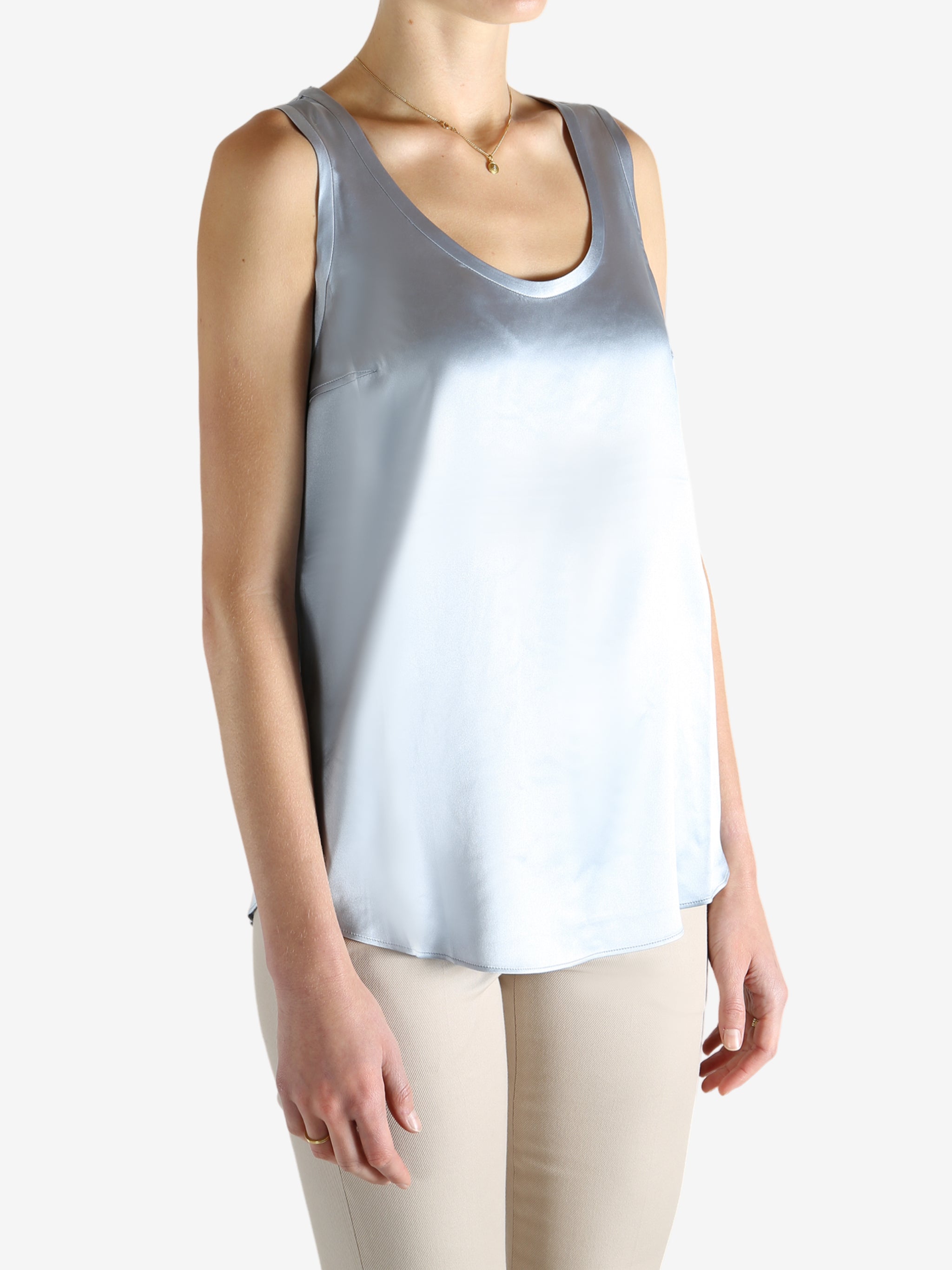 Grey t-shirts worn by a person, showing the t-shirts fit