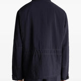 Black jacket worn by a person, showing the jacket's fit