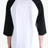 White t-shirt worn by a person, showing the t-shirt's fit