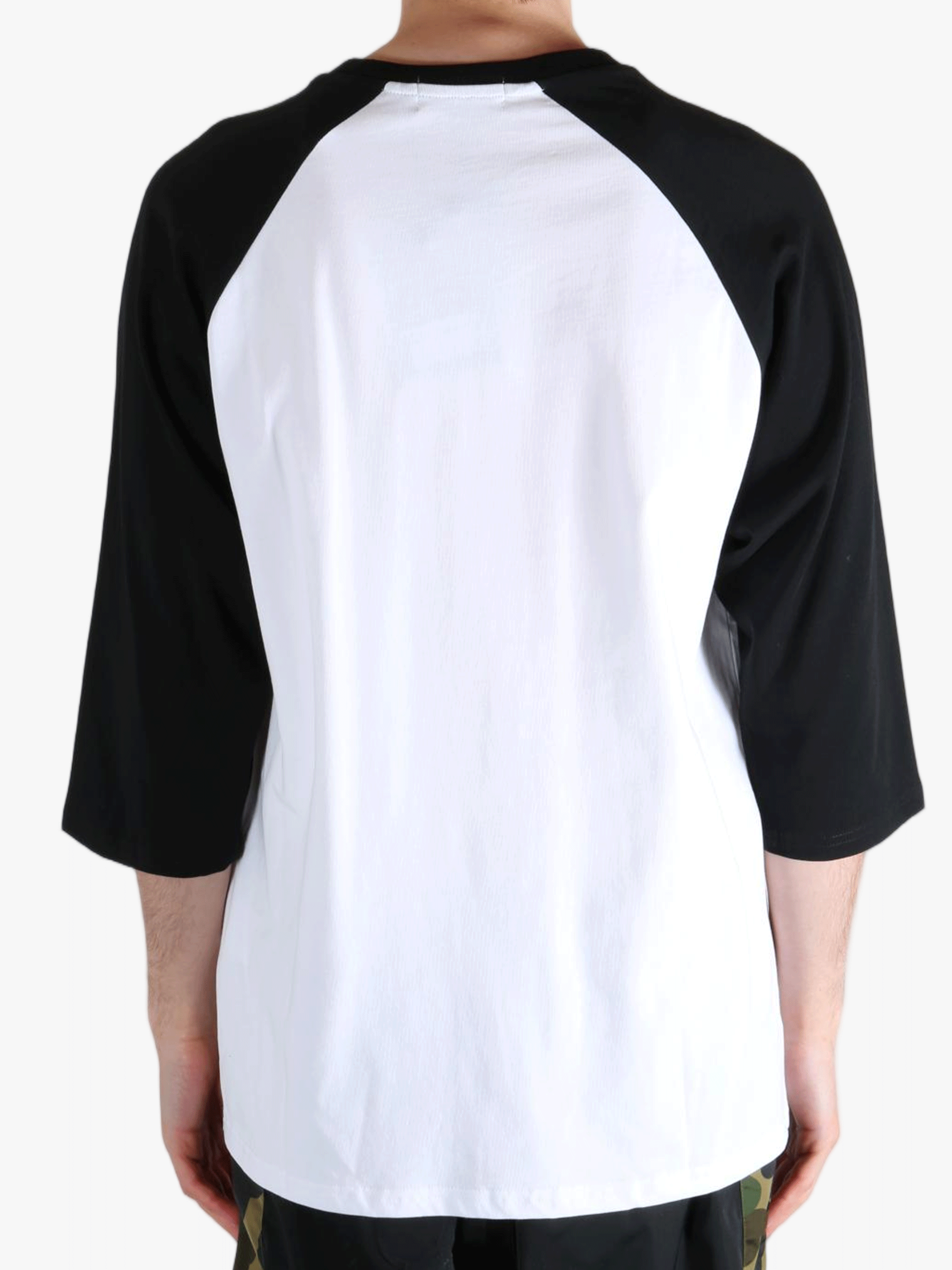 White t-shirt worn by a person, showing the t-shirt's fit