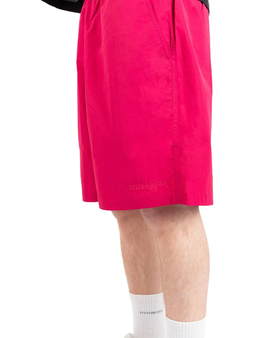 Close up of pink shorts,showing texture of the woven nylonfabric