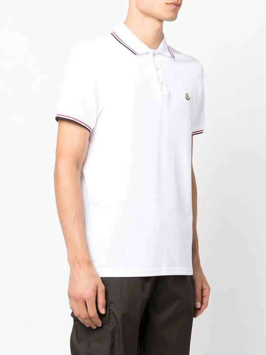 White shirt worn by a person, showing the shirt's fit