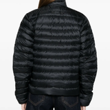 black jacket worn by a person, showing the jacket fit