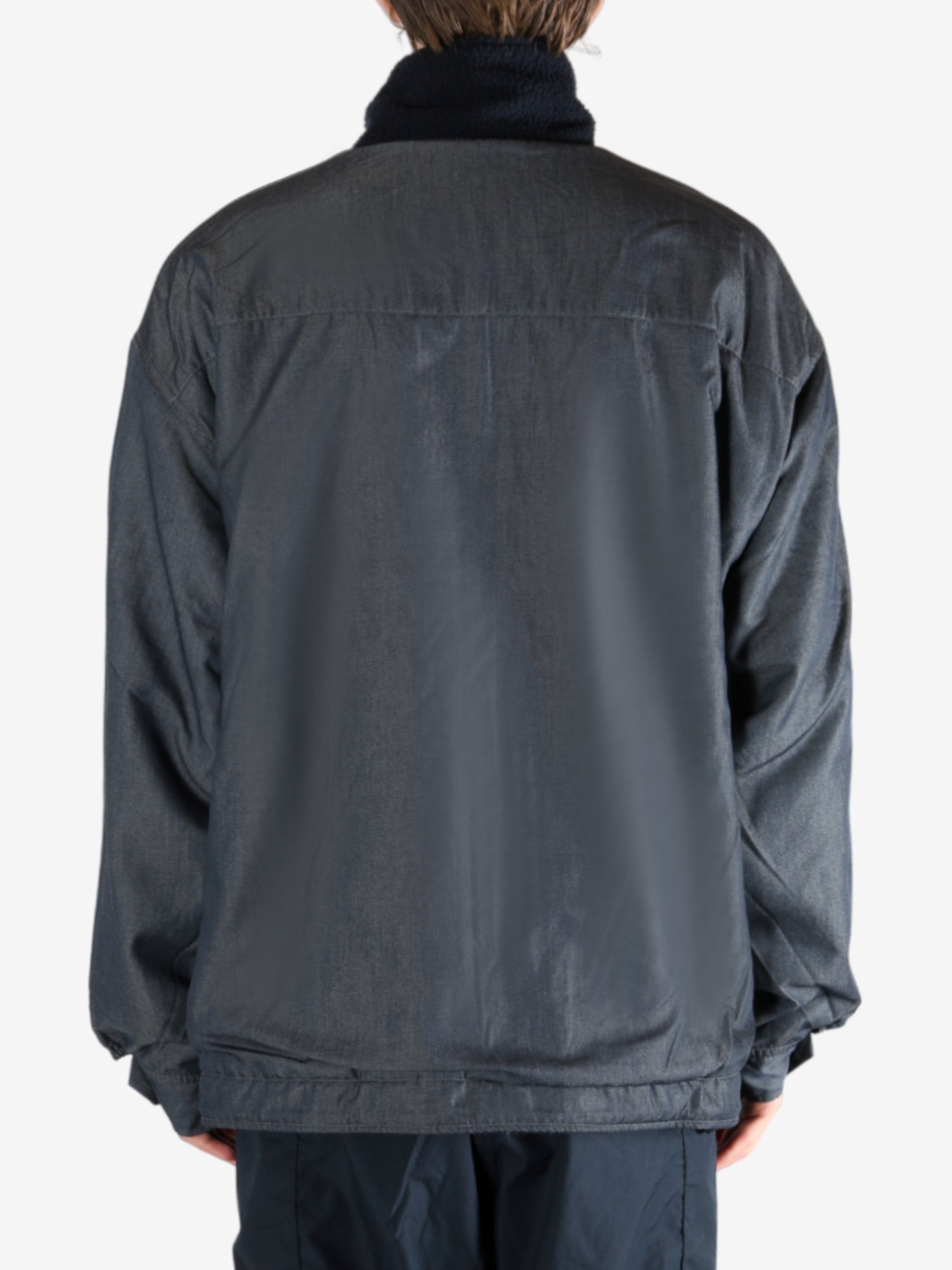 Navy jacket worn by a person, showing the jacket's fit