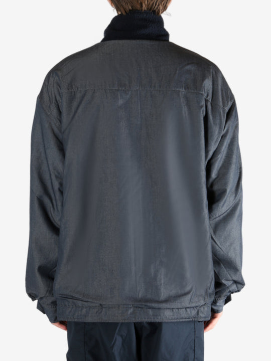 Navy jacket worn by a person, showing the jacket's fit