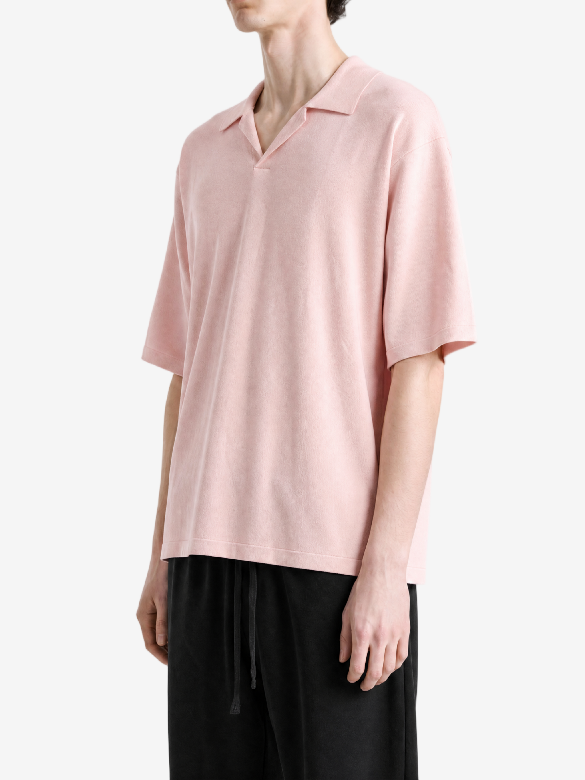 Pink t-shirt worn by a person, showing the t-shirt fit
