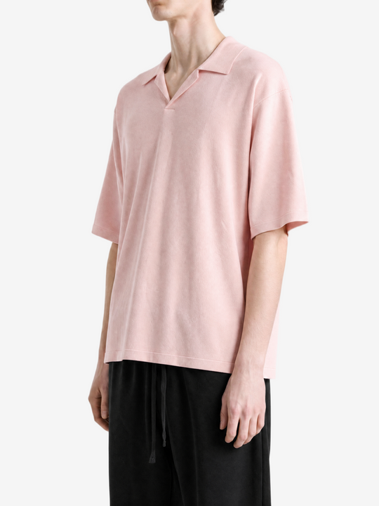 Pink t-shirt worn by a person, showing the t-shirt fit