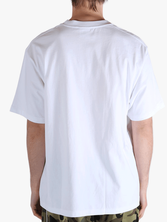 White t-shirt worn by a person, showing the t-shirt's fit