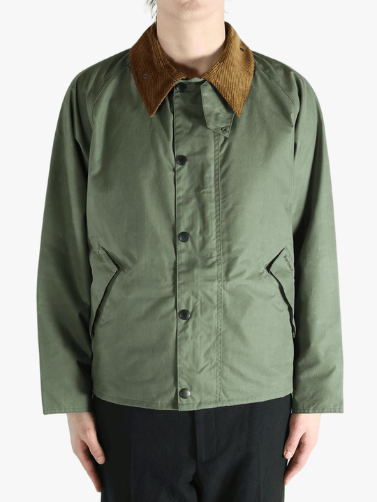 Green jacket worn by a person, showing the jacket fit