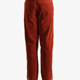 Red pants worn by a person, showing the pants fit