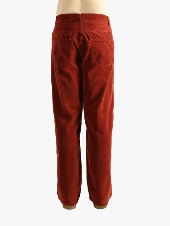 Red pants worn by a person, showing the pants fit