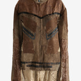 Brown jacket worn by a person, showing the jacket fit